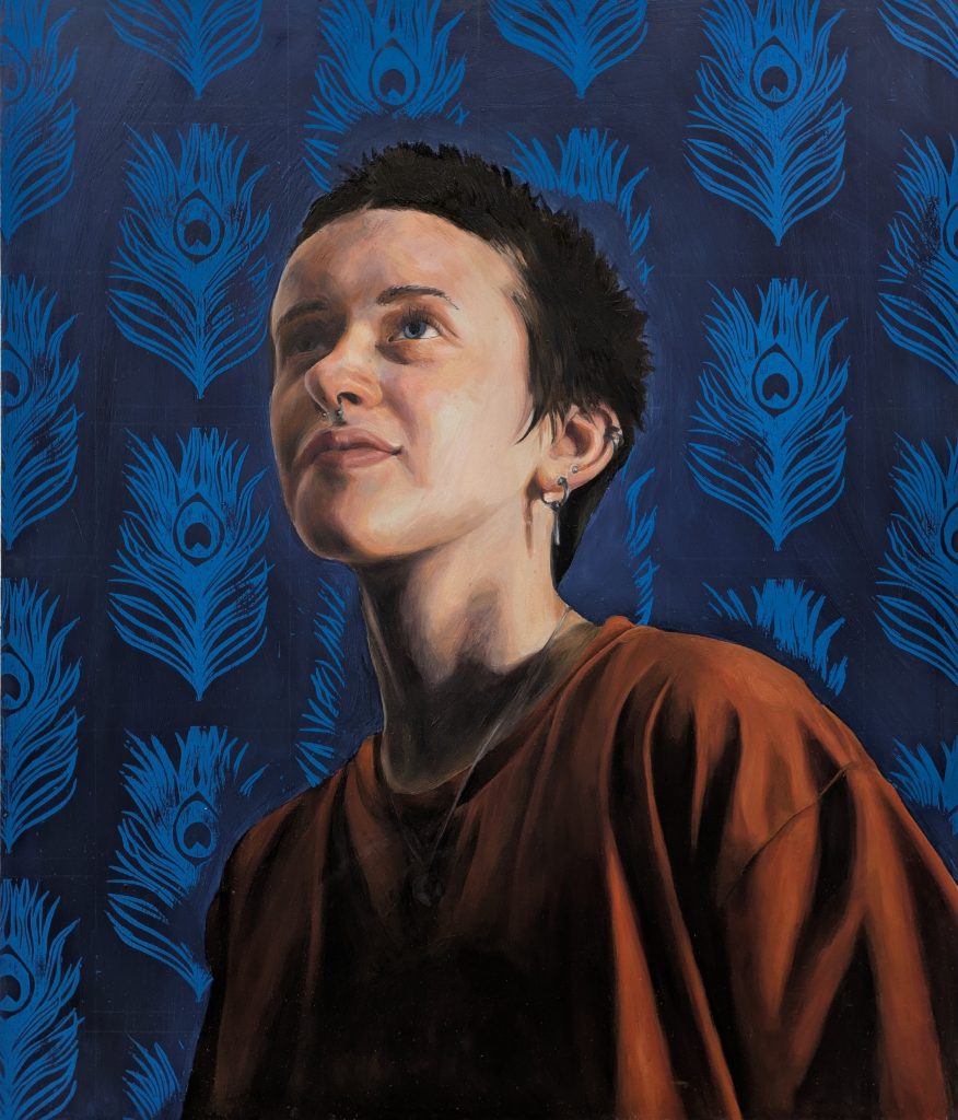 Oil portrait of young man looking up with dramatic shadow cast over one eye. Peacock feather lino prints in background